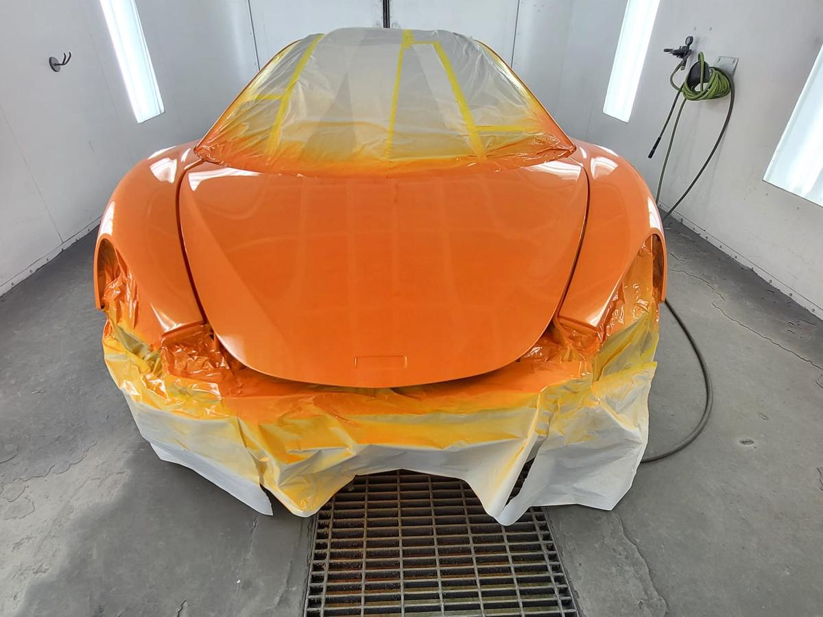 Orange sports car · fresh paint