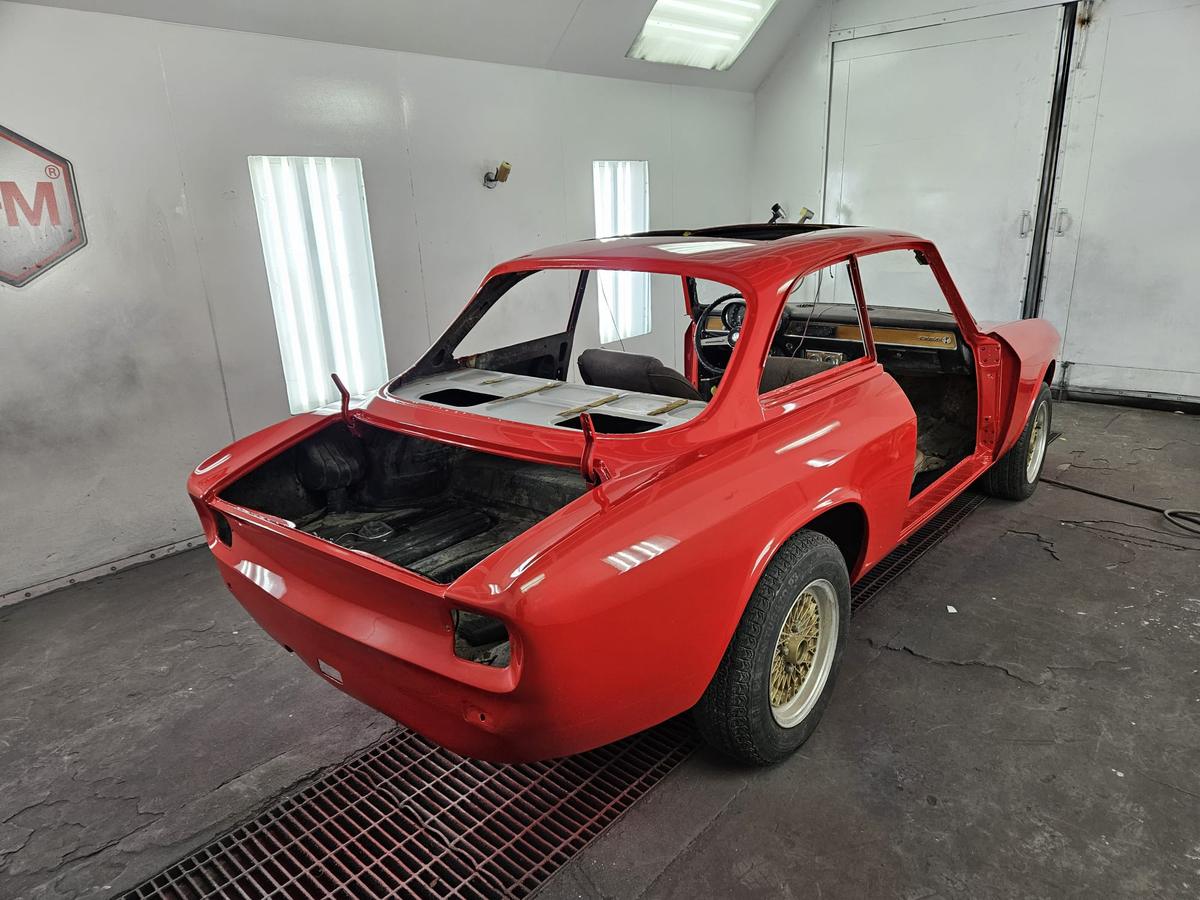 The same coupe painted red